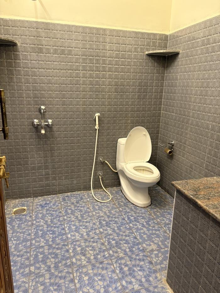 Attached bathroom with toilet and shower