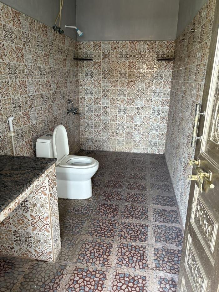 Attached bathroom with toilet and shower