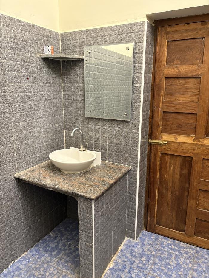 Attached bathroom with sink